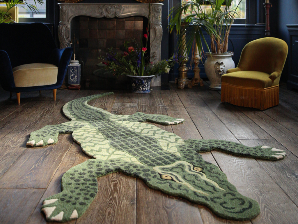 Crocodile-patterned maximalism rug in a vintage living room with fireplace and classic chairs